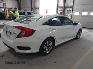 2016 Honda Civic Sedan LX with VIN 19XFC2F59GE028056, listed as a IAAI auction lot 41875940 with 124,243 mi miles. Bid and sale history available at carsss.com. Image 4.