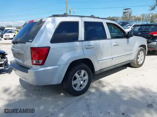 2010 Jeep Grand Cherokee Laredo with VIN 1J4PS4GK3AC163307, listed as a IAAI auction lot 41681527 with 155,464 mi miles. Bid and sale history available at carsss.com. Image 4.