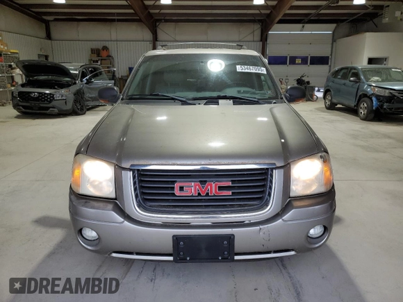 2003 GMC Envoy SLE z VIN 1GKDT13S432136642, wystawiony jako Copart lot #53467095 z przebiegiem 98 832 mil mil oraz Szkoda całkowita • Salvage title. Historia ofert i sprzedaży dostępna na DreamBid. Obrazek 5.