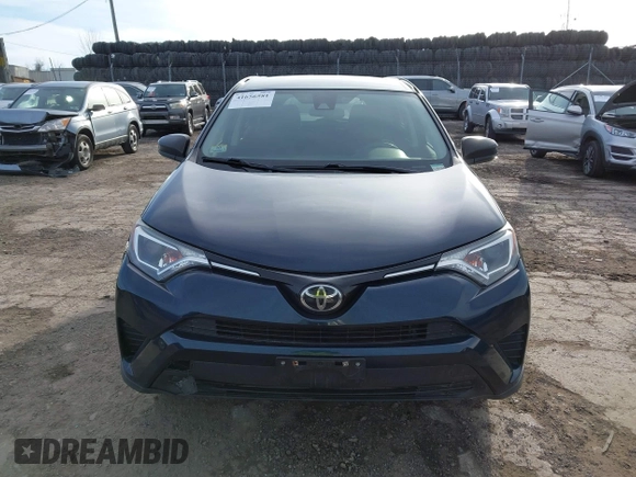 2018 Toyota RAV4 LE with VIN JTMBFREV5JD253342, listed as a IAAI auction lot 41656581 with 243,791 mi miles and . Bid and sale history available at DreamBid. Image 13.