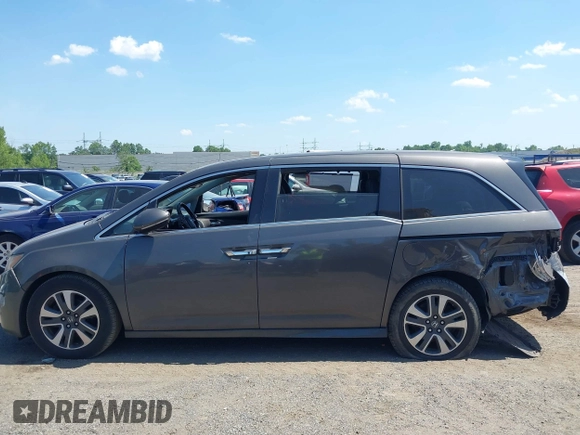 2014 Honda Odyssey Touring with VIN 5FNRL5H90EB082691, listed as a IAAI auction lot 42572977 with 54,413 mi miles and . Bid and sale history available at DreamBid. Image 14.