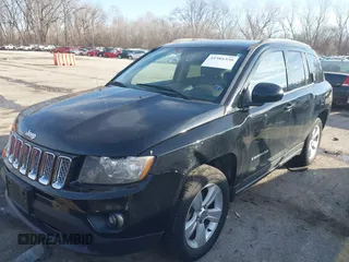 2014 Jeep Compass Latitude with VIN 1C4NJDEBXED661930, listed as a IAAI auction lot 41501558 with 94,133 mi miles and . Bid and sale history available at DreamBid. Image 2.