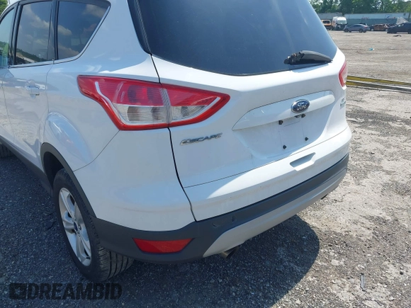2014 Ford Escape SE with VIN 1FMCU9GX9EUC61521, listed as a IAAI auction lot 42535244 with 129,315 mi miles and . Bid and sale history available at DreamBid. Image 6.