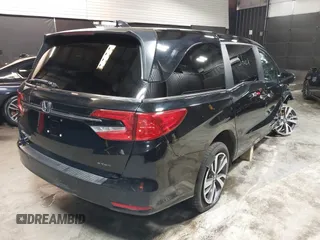 2021 Honda Odyssey Touring with VIN 5FNRL6H83MB040138, listed as a IAAI auction lot 39150096 with 61,322 mi miles and . Bid and sale history available at DreamBid. Image 4.