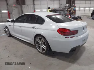 2014 BMW 6 Series 650i xDrive z VIN WBA6B4C55ED371378, wystawiony jako IAAI lot #41640888 z przebiegiem 80 927 mil mil oraz . Historia ofert i sprzedaży dostępna na DreamBid. Obrazek 3.