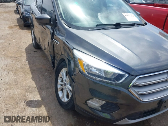 2018 Ford Escape SE z VIN 1FMCU9G98JUC13620, wystawiony jako IAAI lot #42011272 z przebiegiem 71 677 mil mil oraz . Historia ofert i sprzedaży dostępna na DreamBid. Obrazek 6.
