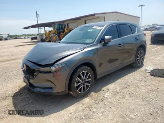 2018 Mazda CX-5 Grand Touring with VIN JM3KFADM4J1402763, listed as a Copart auction lot 61553235 with 57,047 mi miles and Salvage title. Bid and sale history available at DreamBid. Image 1.