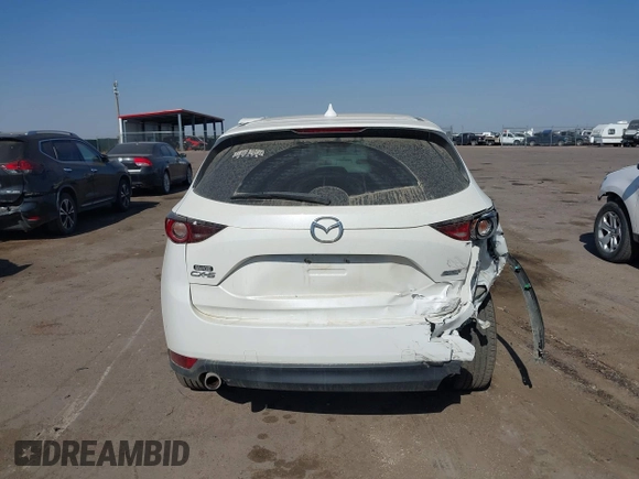 2017 Mazda CX-5 Sport with VIN JM3KFABL5H0124725, listed as a IAAI auction lot 40487298 with 103,889 mi miles. Bid and sale history available at carsss.com. Image 16.