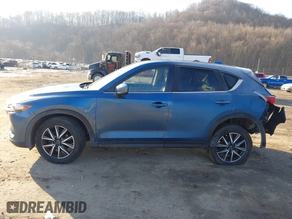 2018 Mazda CX-5 Touring z VIN JM3KFBCM2J0461954, wystawiony jako IAAI lot #41655865 z przebiegiem 129 333 mil mil oraz . Historia ofert i sprzedaży dostępna na DreamBid. Obrazek 13.