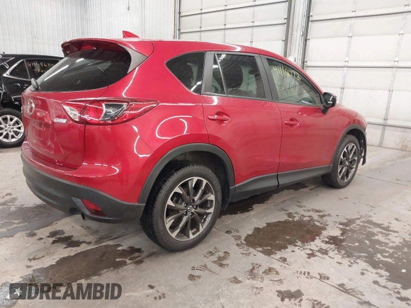 2016 Mazda CX-5 Grand Touring with VIN JM3KE4DY7G0731057, listed as a IAAI auction lot 41118072 with 134,107 mi miles and . Bid and sale history available at carsss.com. Image 4.