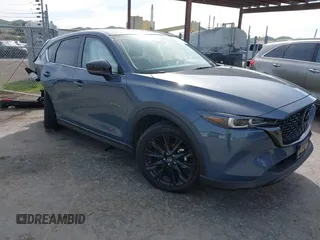 2023 Mazda CX-5 2.5 S Carbon Edition with VIN JM3KFBCM9P0240506, listed as a IAAI auction lot 41583703 with 23,173 mi miles. Bid and sale history available at carsss.com. Image 1.