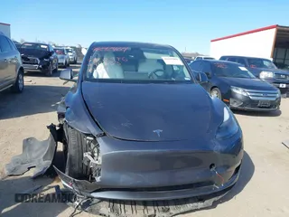 2022 Tesla Model Y Performance z VIN 7SAYGDEF8NF494753, wystawiony jako IAAI lot #41692464 z przebiegiem 14 616 mil mil oraz . Historia ofert i sprzedaży dostępna na DreamBid. Obrazek 12.