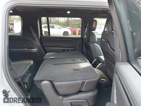 2024 Rivian R1S Adventure with VIN 7PDSGBBA1RN040036, listed as a IAAI auction lot 41694635 with 13,855 mi miles. Bid and sale history available at carsss.com. Image 8.