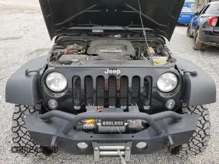 2014 Jeep Wrangler Sport with VIN 1C4AJWAG5EL326480, listed as a Copart auction lot 60653955 with 94,102 mi miles and Salvage title. Bid and sale history available at DreamBid. Image 11.