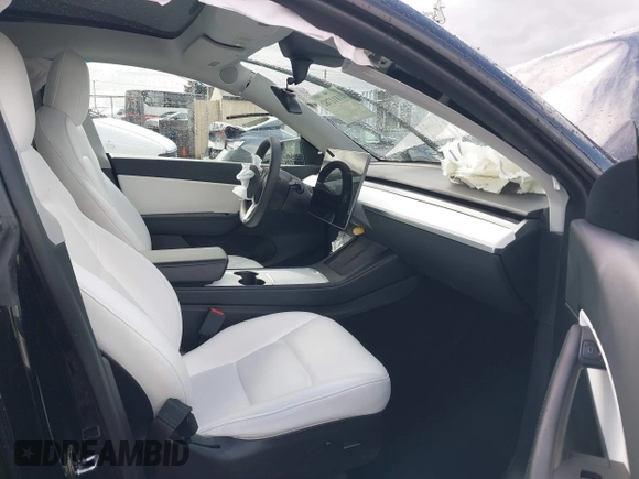 2022 Tesla Model Y Long Range z VIN 7SAYGDEE4NF447985, wystawiony jako IAAI lot #41811782 z przebiegiem 81 973 mil mil oraz . Historia ofert i sprzedaży dostępna na DreamBid. Obrazek 5.