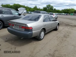1999 Toyota Camry LE с VIN 4T1BG22K6XU404532, выставлен на аукционе Copart как лот 57449655 с пробегом 173 587 миль миль и Списание • Salvage title. История ставок и продаж доступна на DreamBid. Изображение 3.