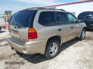 2005 GMC Envoy SLE with VIN 1GKDT13S252264932, listed as a IAAI auction lot 41981566 with 140,566 mi miles. Bid and sale history available at carsss.com. Image 4.