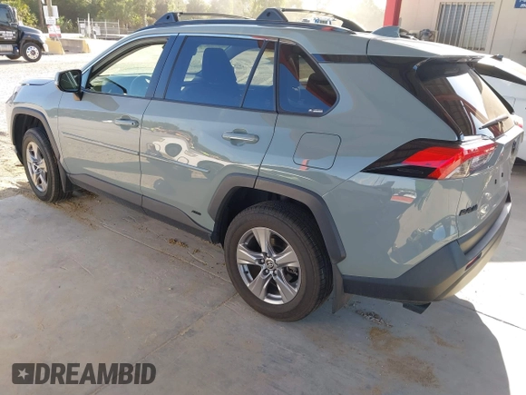 2022 Toyota RAV4 Hybrid XLE with VIN JTMRWRFV9NJ054668, listed as a IAAI auction lot 42606261 with 61,794 mi miles and . Bid and sale history available at DreamBid. Image 3.
