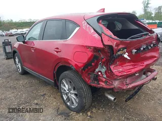 2020 Mazda CX-5 Grand Touring with VIN JM3KFBDM7L1731837, listed as a IAAI auction lot 42160795 with 63,826 mi miles and . Bid and sale history available at DreamBid. Image 3.