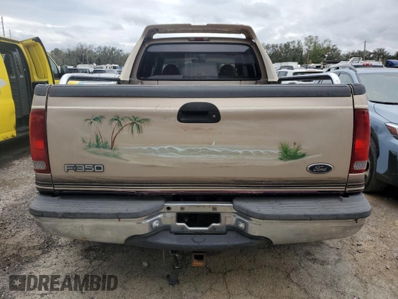 1999 Ford F-350 XL z VIN 1FTWW32F1XEA00890, wystawiony jako Copart lot #81316284 z przebiegiem 221 920 mil mil oraz Nie do naprawy • Non repairable. Historia ofert i sprzedaży dostępna na DreamBid. Obrazek 6.