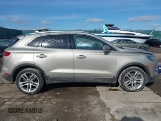2015 Lincoln MKC z VIN 5LMCJ2A96FUJ47386, wystawiony jako IAAI lot #41525018 z przebiegiem 97 670 mil mil oraz . Historia ofert i sprzedaży dostępna na DreamBid. Obrazek 13.