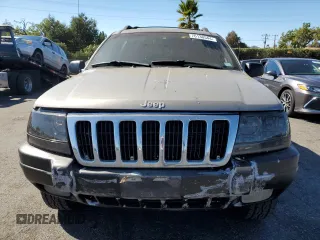 1999 Jeep Grand Cherokee Laredo with VIN 1J4GW58N4XC739465, listed as a Copart auction lot 76130544 with 195,649 mi miles and Salvage title. Bid and sale history available at DreamBid. Image 5.