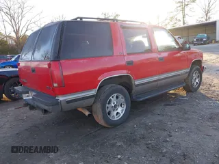 1999 GMC Yukon with VIN 1GKEK13R9XJ748190, listed as a IAAI auction lot 41317890 with 330,490 mi miles. Bid and sale history available at carsss.com. Image 4.