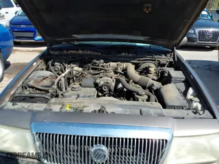 2003 Mercury Grand Marquis GS Convenience with VIN 2MEFM74W43X662724, listed as a IAAI auction lot 42036847 with 234,008 mi miles. Bid and sale history available at carsss.com. Image 10.