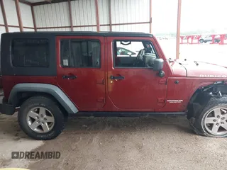2010 Jeep Wrangler Unlimited Rubicon z VIN 1J4HA6H18AL180628, wystawiony jako IAAI lot #42110357 z przebiegiem 217 940 mil mil oraz . Historia ofert i sprzedaży dostępna na DreamBid. Obrazek 13.
