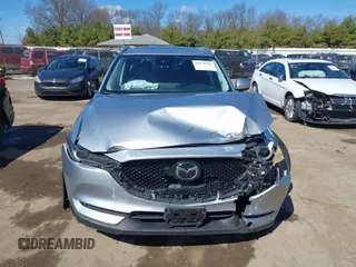 2021 Mazda CX-5 Grand Touring with VIN JM3KFBDM3M1300316, listed as a IAAI auction lot 41878520 with 77,670 mi miles and . Bid and sale history available at DreamBid. Image 12.
