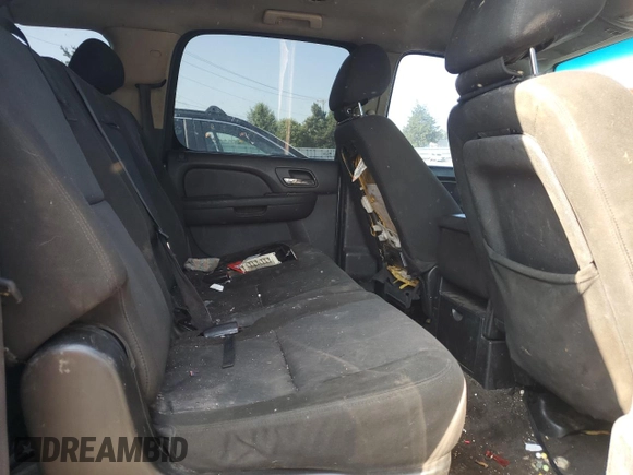 2010 Chevrolet Suburban LS z VIN 1GNUKHE32AR212268, wystawiony jako Copart lot #57613895 z przebiegiem 294 117 mil mil oraz Szkoda całkowita • Salvage title. Historia ofert i sprzedaży dostępna na DreamBid. Obrazek 11.
