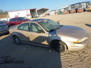 2004 Oldsmobile Alero GL1 z VIN 1G3NL52E34C191243, wystawiony jako IAAI lot #41536825 z przebiegiem 117 998 mil mil oraz . Historia ofert i sprzedaży dostępna na DreamBid. Obrazek 13.
