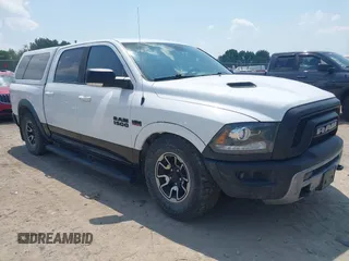 2017 Ram 1500 Rebel z VIN 1C6RR7YTXHS545893, wystawiony jako IAAI lot #42436516 z przebiegiem 193 397 mil mil oraz . Historia ofert i sprzedaży dostępna na DreamBid. Obrazek 1.