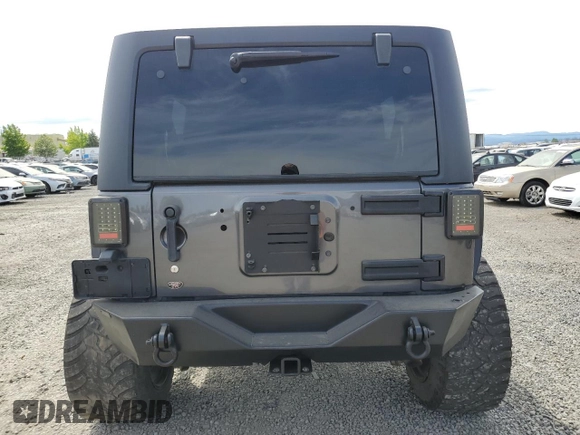 2016 Jeep Wrangler Unlimited Freedom with VIN 1C4BJWDG8GL300314, listed as a Copart auction lot 61044645 with 103,396 mi miles and Clean title. Bid and sale history available at DreamBid. Image 6.
