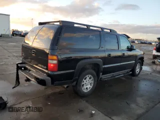 2001 Chevrolet Suburban LS z VIN 3GNFK16T91G221421, wystawiony jako Copart lot #87094634 z przebiegiem 186 977 mil mil oraz Szkoda całkowita • Salvage title. Historia ofert i sprzedaży dostępna na DreamBid. Obrazek 3.