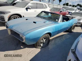 1967 Pontiac Firebird z VIN 223677U101685, wystawiony jako Copart lot #74851504 z przebiegiem 68 172 mil mil oraz Nie do naprawy. Historia ofert i sprzedaży dostępna na DreamBid. Obrazek 1.