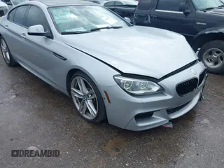 2015 BMW 6 Series 640i z VIN WBA6A0C51FD318982, wystawiony jako IAAI lot #41875547 z przebiegiem 60 968 mil mil oraz . Historia ofert i sprzedaży dostępna na DreamBid. Obrazek 19.
