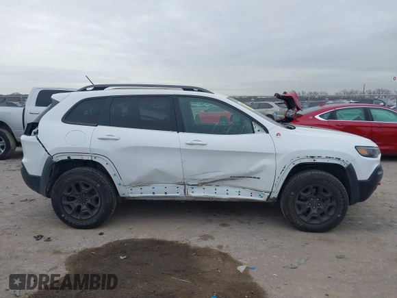 2019 Jeep Cherokee Trailhawk with VIN 1C4PJMBN6KD124023, listed as a IAAI auction lot 41432217 with 76,934 mi miles and . Bid and sale history available at DreamBid. Image 14.