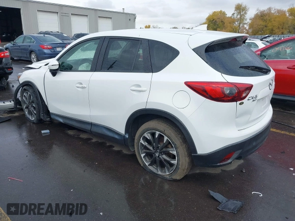 2016 Mazda CX-5 Grand Touring with VIN JM3KE4DY0G0705691, listed as a IAAI auction lot 40880798 with 130,624 mi miles. Bid and sale history available at carsss.com. Image 3.