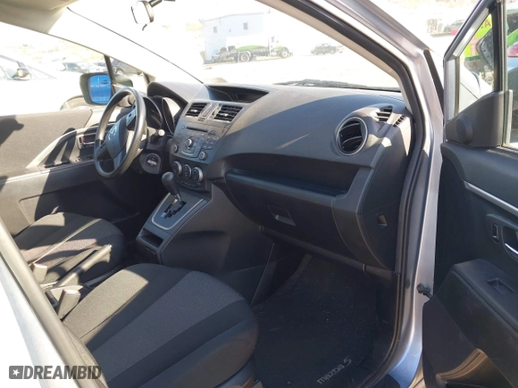 2012 Mazda Mazda5 Sport with VIN JM1CW2BL7C0105928, listed as a IAAI auction lot 42061224 with 59,993 mi miles. Bid and sale history available at carsss.com. Image 5.