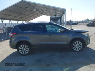 2018 Ford Escape Titanium with VIN 1FMCU0J98JUA03474, listed as a IAAI auction lot 37677880 with 106,423 mi miles and . Bid and sale history available at DreamBid. Image 13.