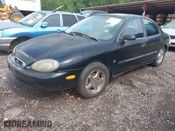 1999 Mercury Sable LS Premium Group z VIN 1MEFM53S7XA632876, wystawiony jako IAAI lot #42303137 z przebiegiem 178 617 mil mil oraz . Historia ofert i sprzedaży dostępna na DreamBid. Obrazek 2.
