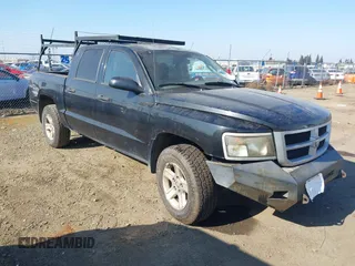 2010 Dodge Dakota Bighorn/Lonestar with VIN 1D7CW3GK1AS155513, listed as a IAAI auction lot 41437670 with 184,199 mi miles. Bid and sale history available at carsss.com. Image 1.