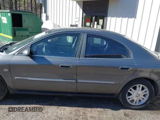 2004 Mercury Sable LS Premium z VIN 1MEHM55S54G607845, wystawiony jako IAAI lot #41812758 z przebiegiem 200 883 mil mil oraz . Historia ofert i sprzedaży dostępna na DreamBid. Obrazek 14.