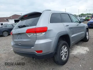 2018 Jeep Grand Cherokee Laredo E with VIN 1C4RJFAG5JC377197, listed as a IAAI auction lot 42432131 with 58,981 mi miles and . Bid and sale history available at DreamBid. Image 4.