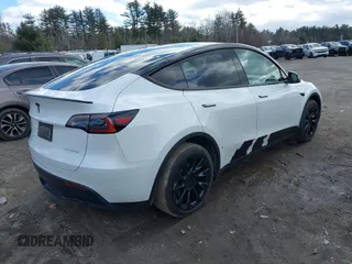 2023 Tesla Model Y Long Range with VIN 7SAYGDEE7PF832007, listed as a IAAI auction lot 41751598 with 14,126 mi miles and . Bid and sale history available at DreamBid. Image 4.