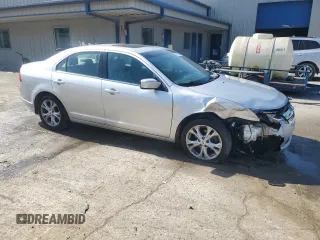 2012 Ford Fusion SE with VIN 3FAHP0HGXCR331498, listed as a Copart auction lot 61859325 with 61,445 mi miles and Salvage title. Bid and sale history available at DreamBid. Image 4.