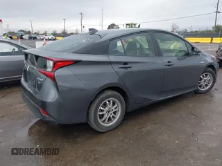 2021 Toyota Prius L Eco with VIN JTDKAMFUXM3143646, listed as a IAAI auction lot 41507110 with 207,238 mi miles. Bid and sale history available at carsss.com. Image 4.