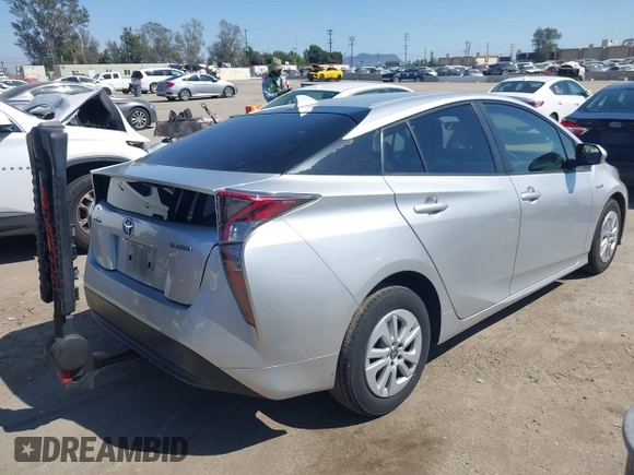 2018 Toyota Prius Two with VIN JTDKBRFU6J3068322, listed as a IAAI auction lot 42001483 with 57,597 mi miles. Bid and sale history available at carsss.com. Image 4.