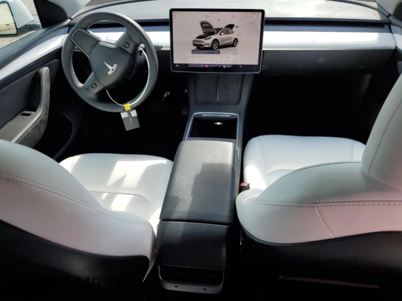 2023 Tesla Model Y Long Range with VIN 7SAYGAEE6PF795434, listed as a Copart auction lot 67507984 with 24,469 mi miles and Salvage Title. Bid and sale history available at DreamBid. Image 8.